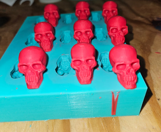 9-Cavity skull silicone mold Get spooky and creative with our Skull Mold! Perfect for chocolate or wax melts. Easy-peasy and fun!